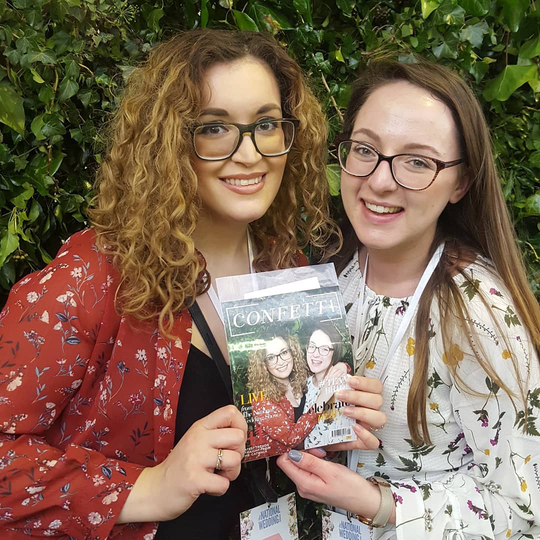 two girls holding their Magazine Cover Photo Booth photo