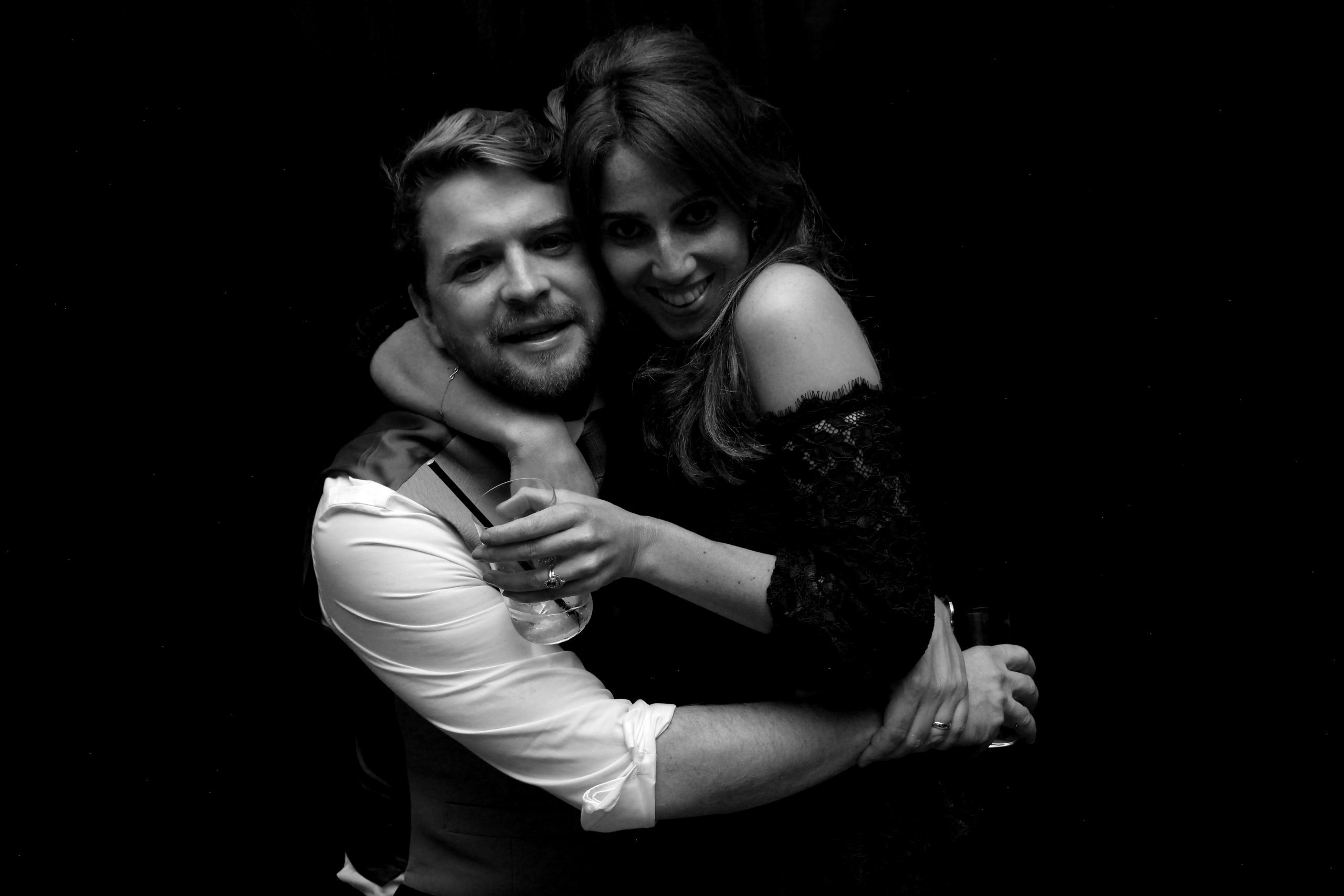 Guests posing for a black and white Hollywood Glam photo booth portrait