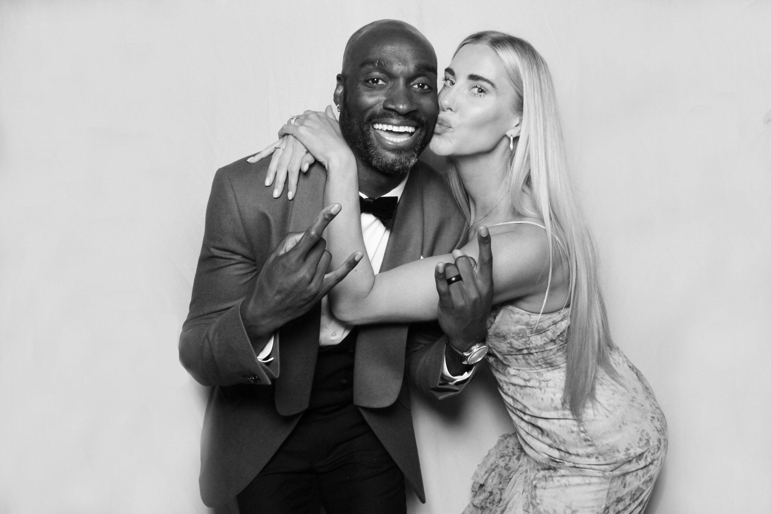 Guests posing for a black and white Hollywood Glam photo booth portrait